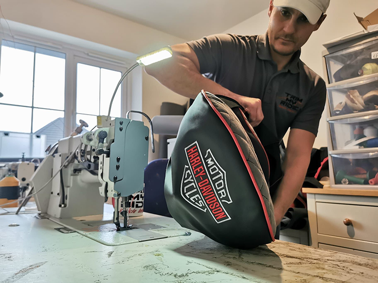 Trimming a motorbike seat by hand